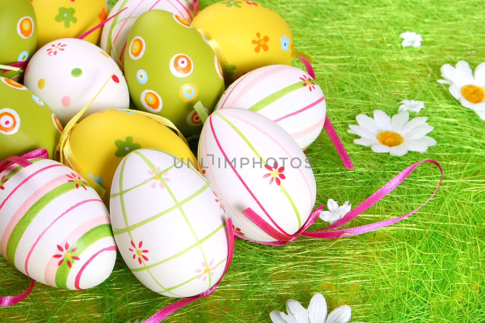 Painted Colorful Easter Eggs on green Grass