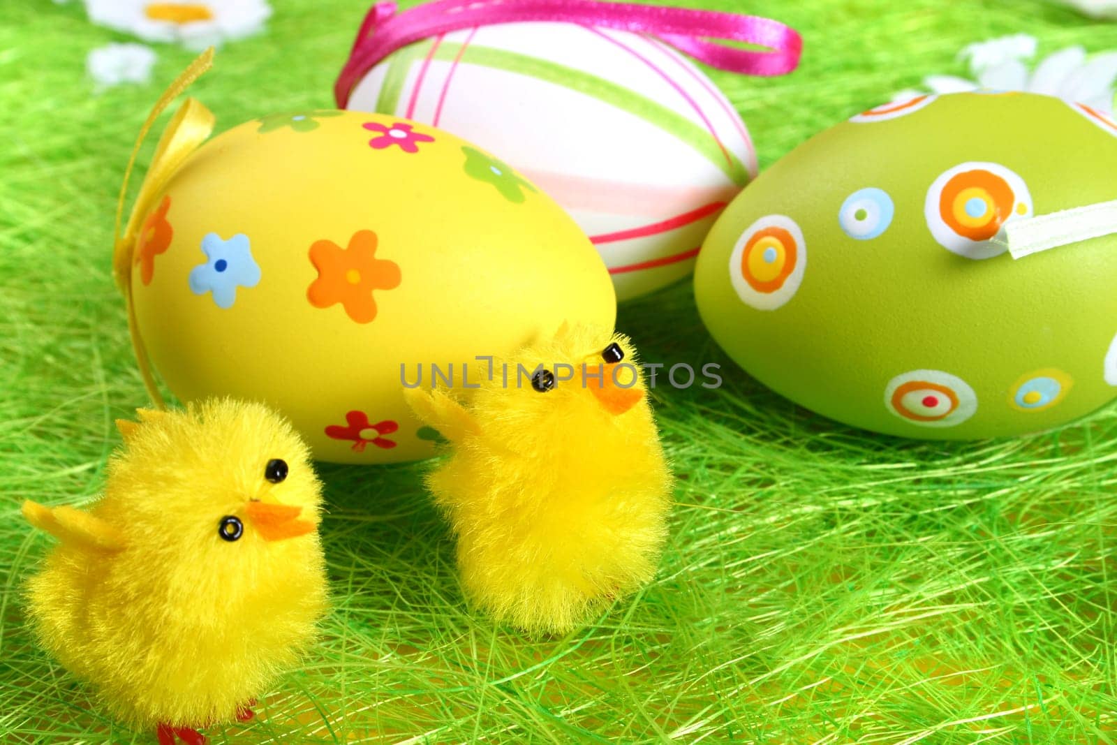 Painted Colorful Easter Eggs on green Grass