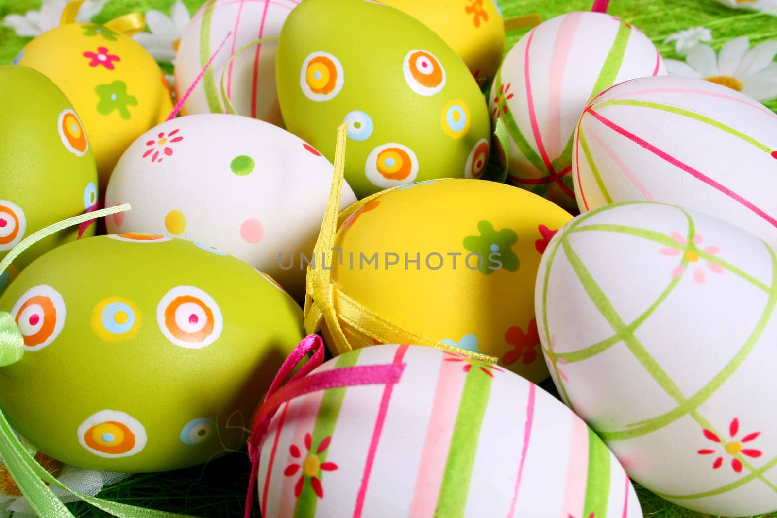 Painted Colorful Easter Eggs on green Grass