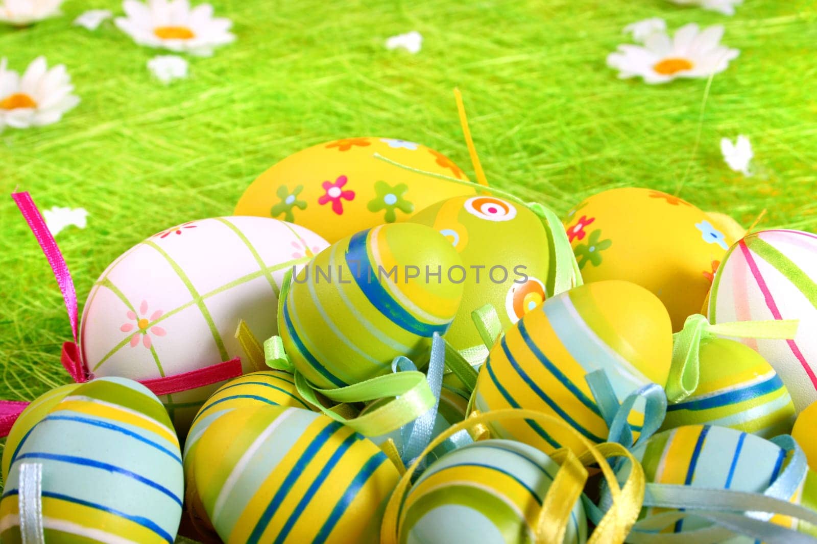 Painted Colorful Easter Eggs on green Grass