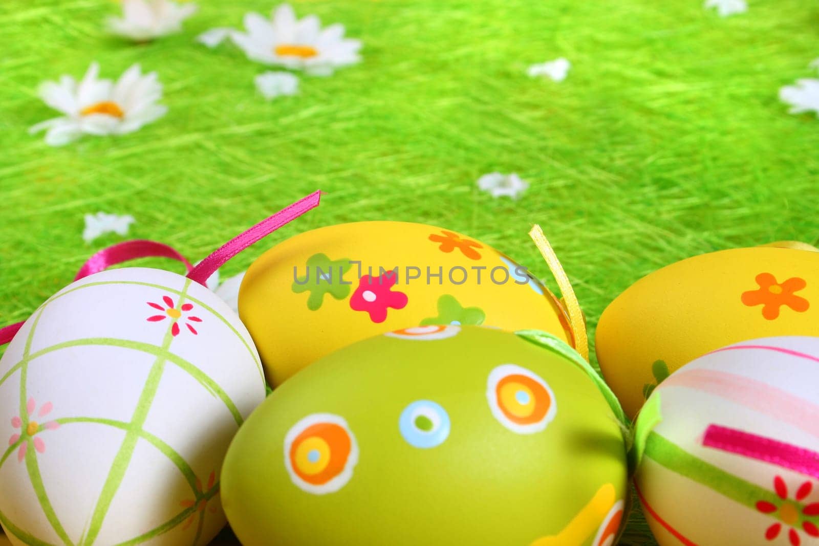 Painted Colorful Easter Eggs on green Grass
