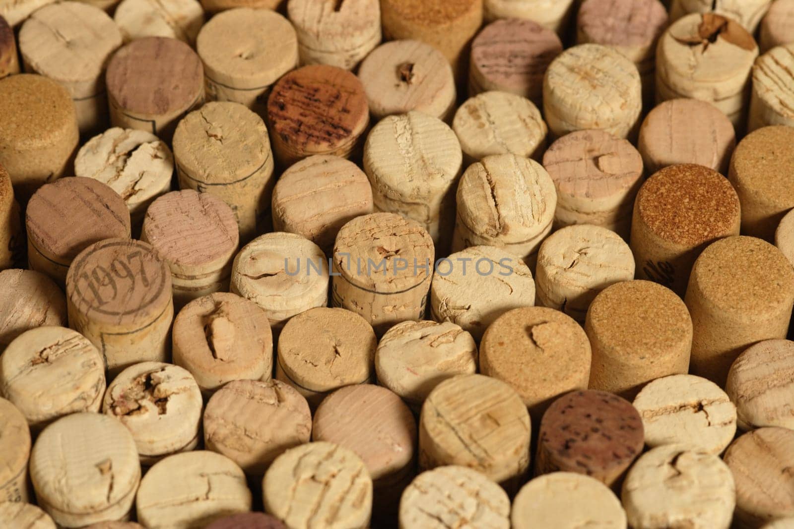 A group of red and white wine corks.