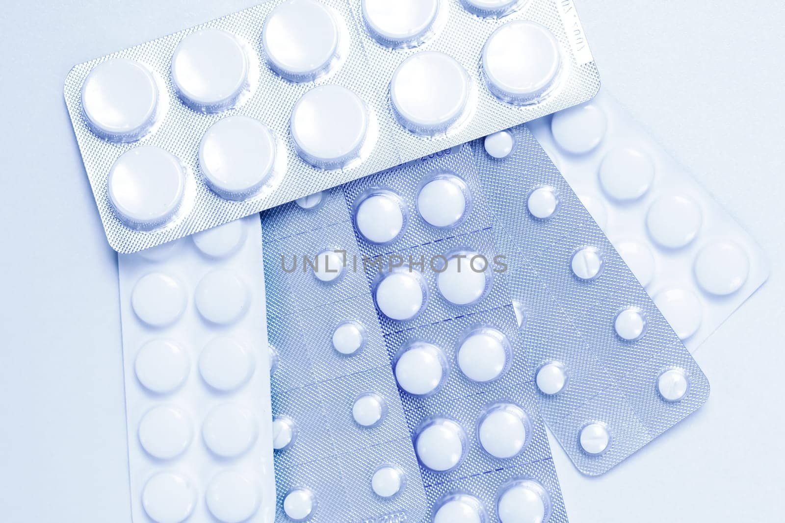 Pills as background in blue tone