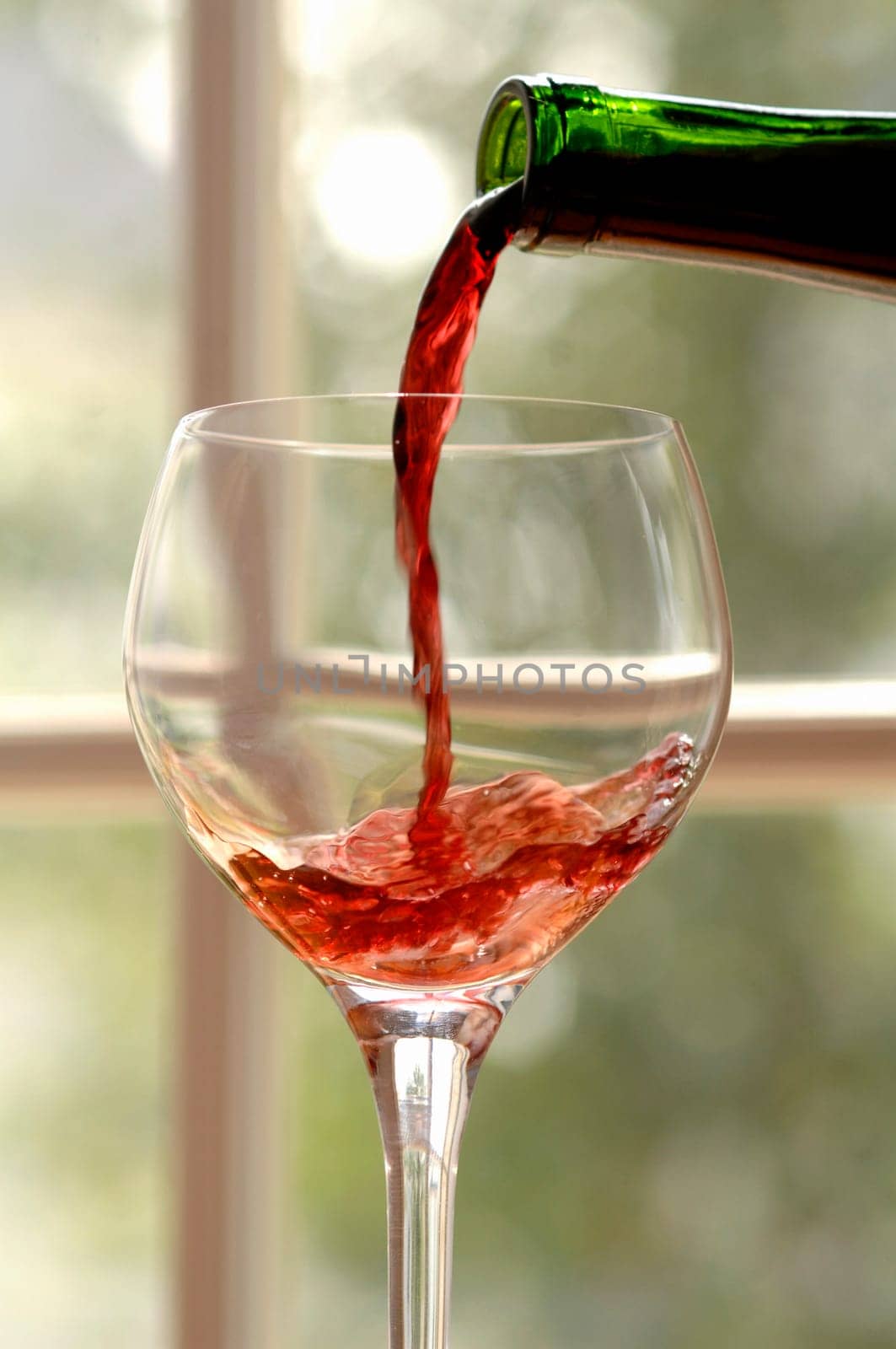 red wine poured into a glass