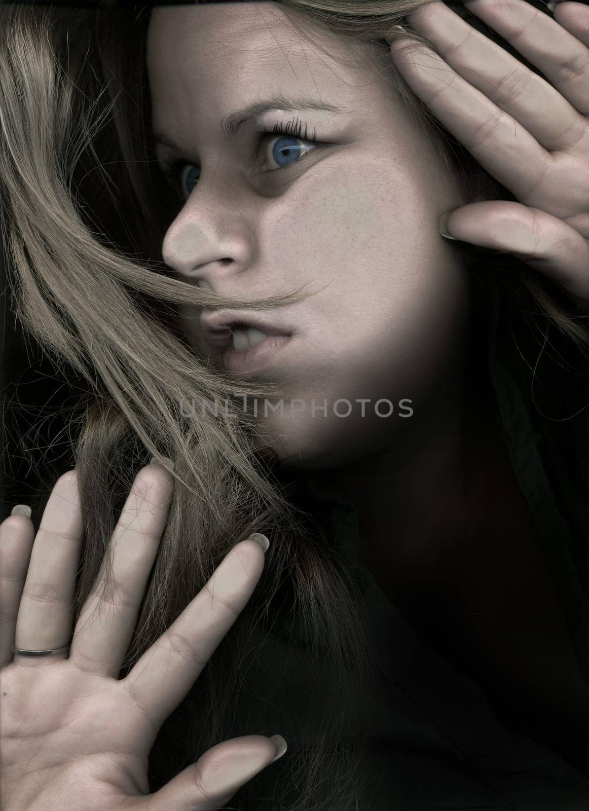 Woman trapped behind glass