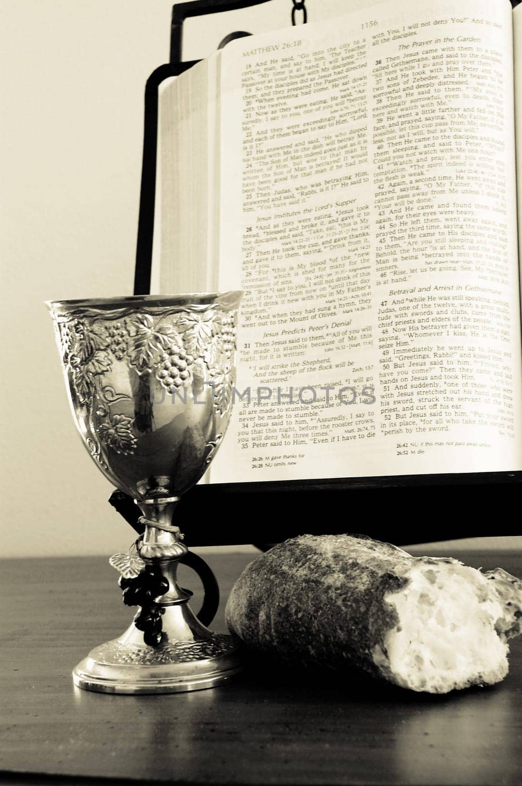 Bible, bread, and wine cup. Symbol of the Lord's Supper.