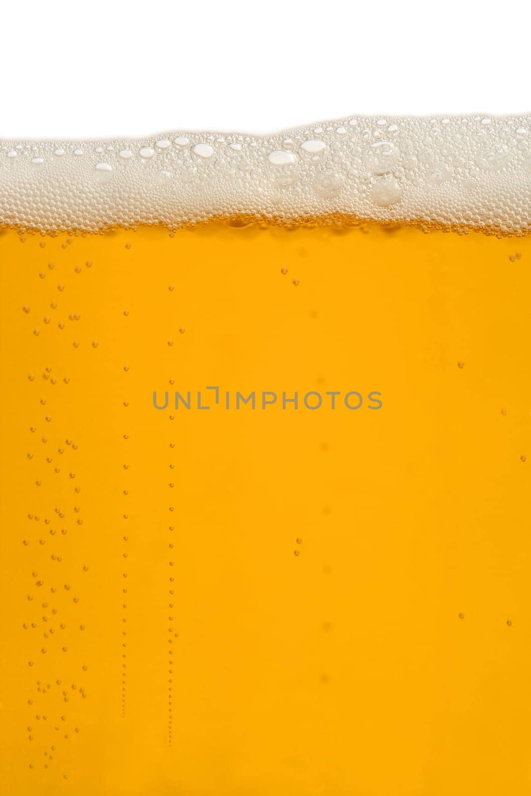 A macro image of a glass of beer.
