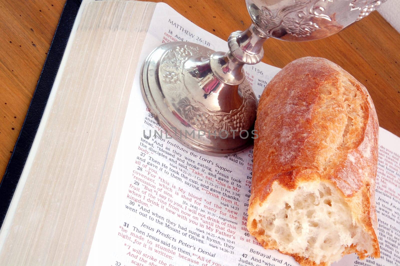 Bible, bread, and wine cup. Symbol of the Lord's Supper.