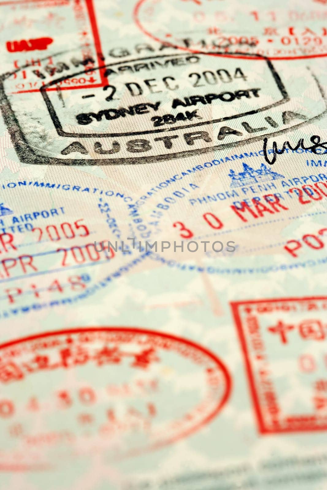Macro / selective focus image of passport stamps.  Focus is on the word Australia.