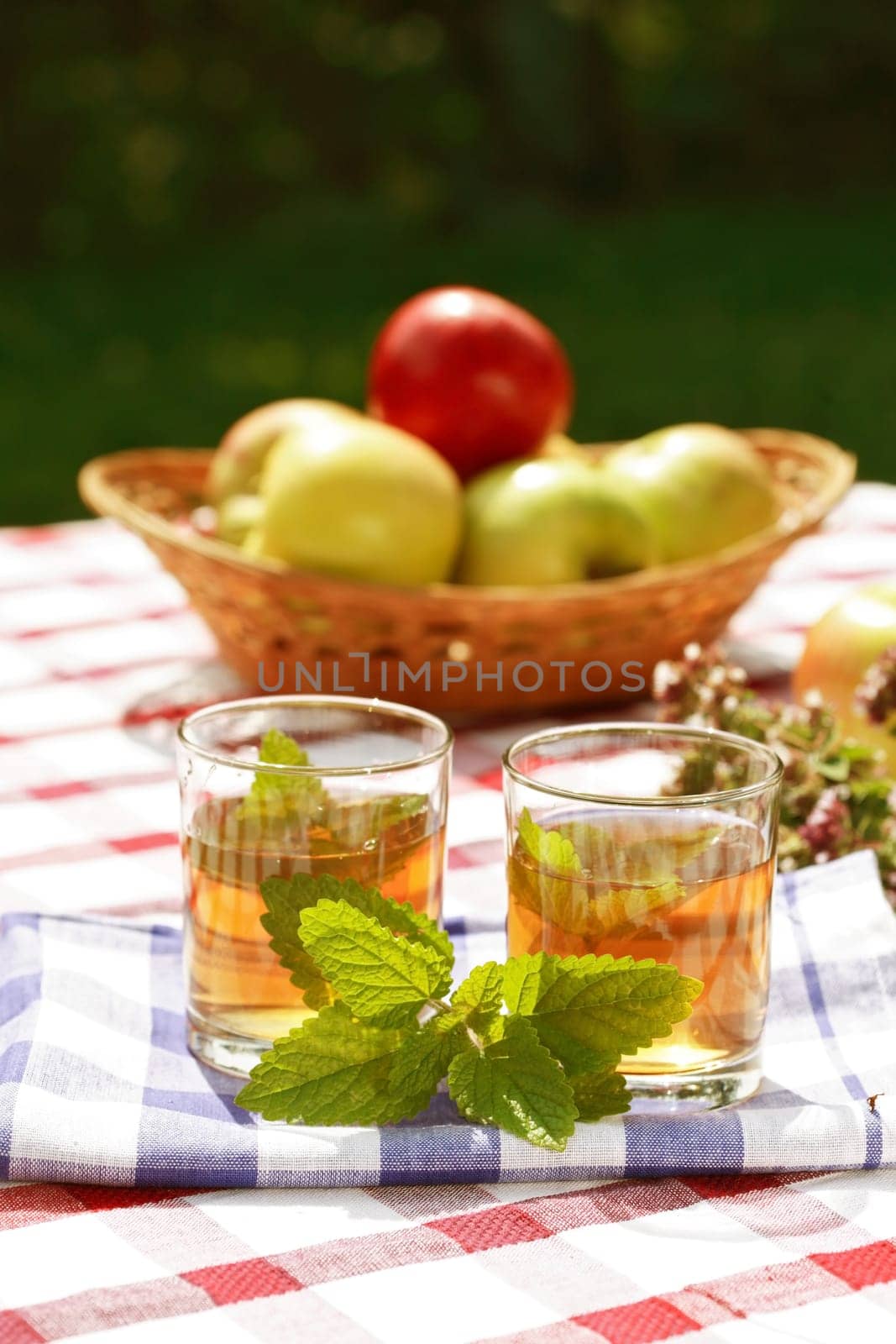 Fresh herbal tea served outdoor in garden or restaurant