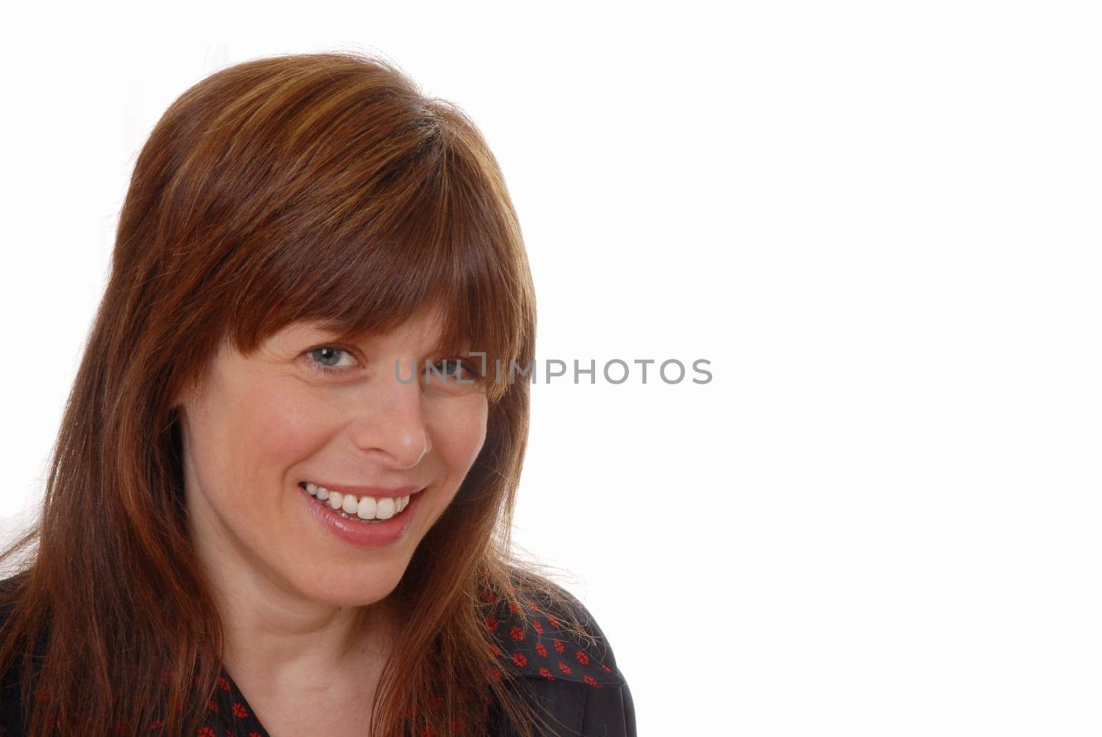 smiling friendly young female office executive isolated on white