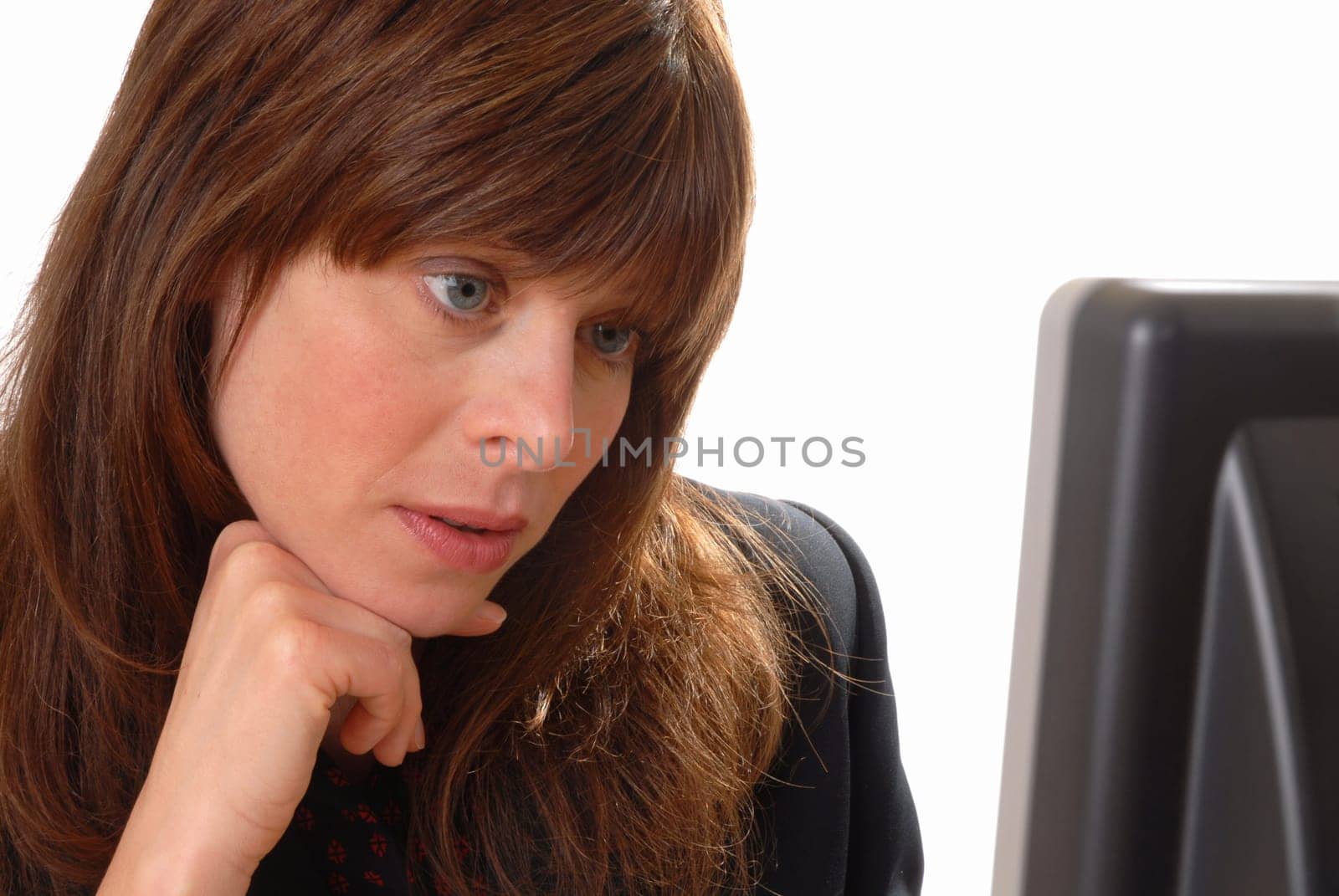 attractive young executive brunette with computer, isolated on white