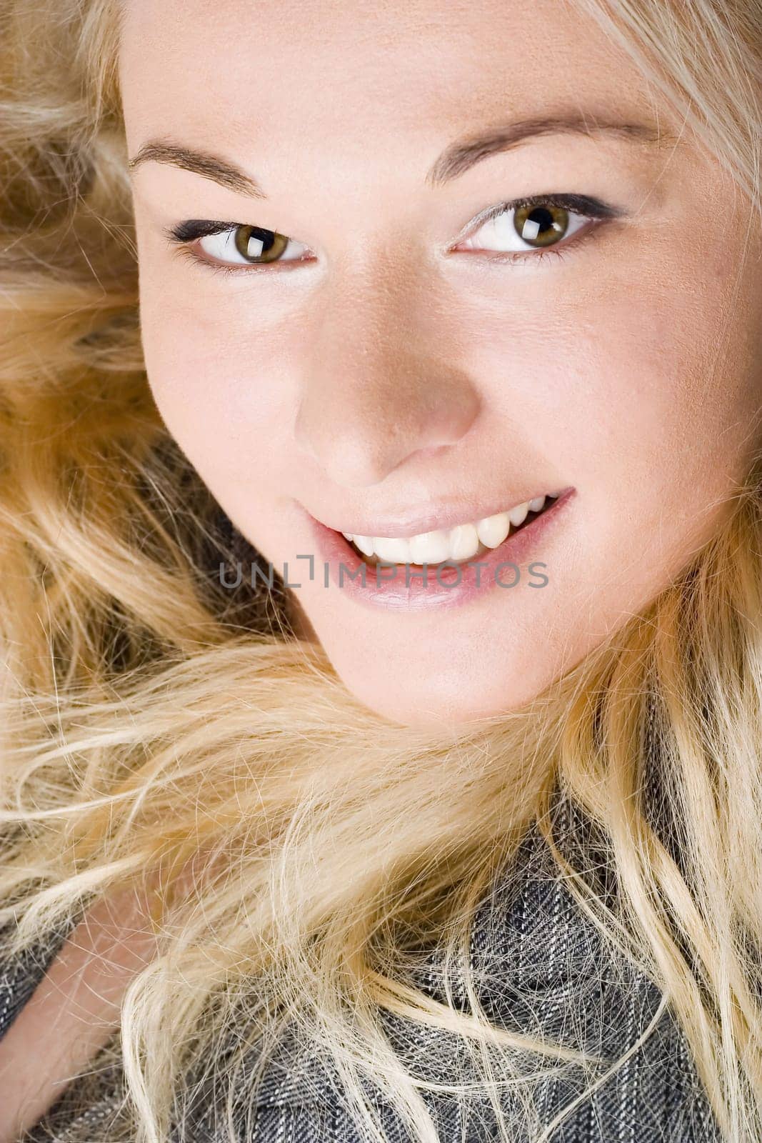 Elegant businesswoman wearing a suit. Blond long hair.