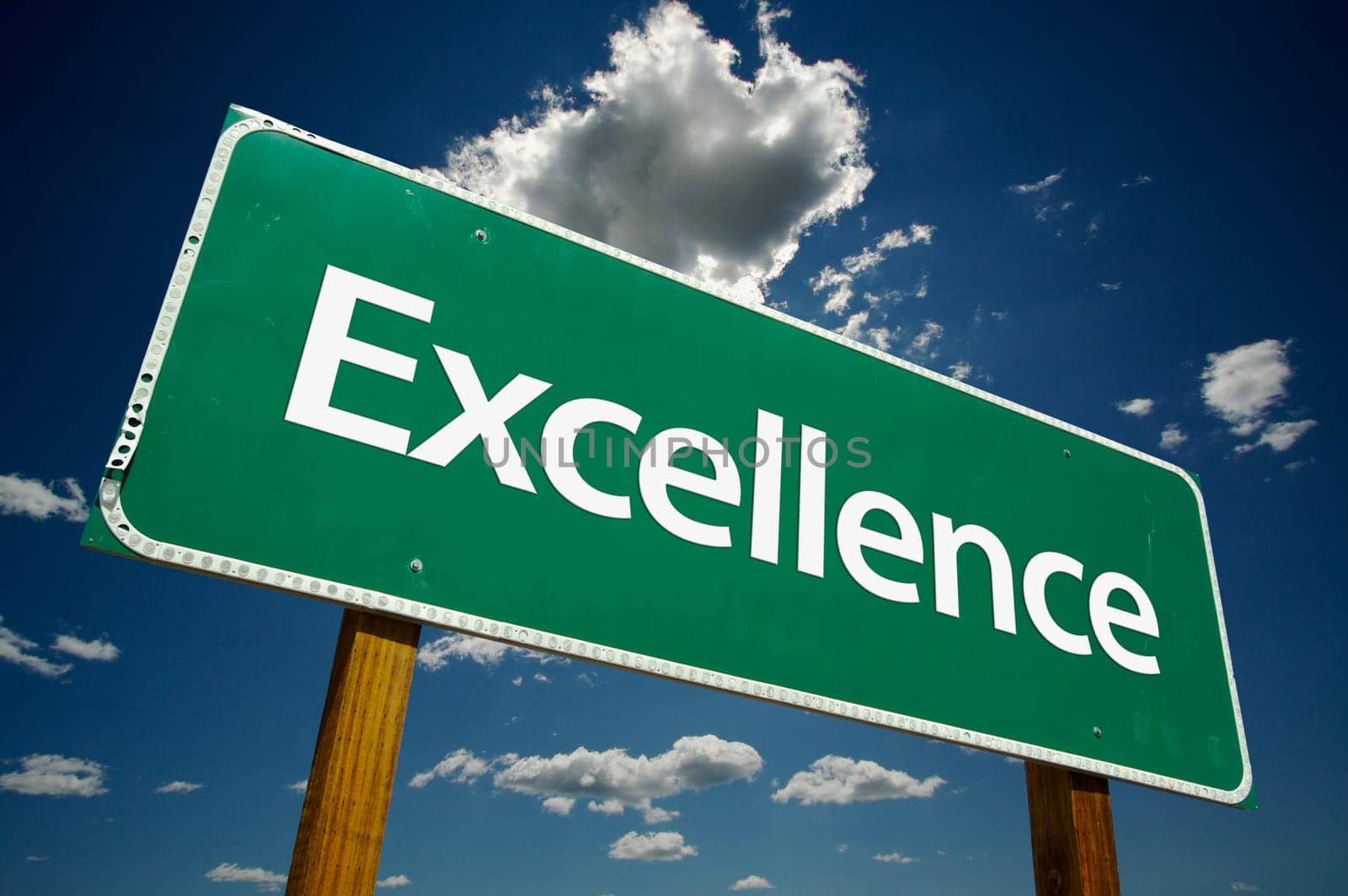 Excellence Road Sign and dramatic clouds and sky.