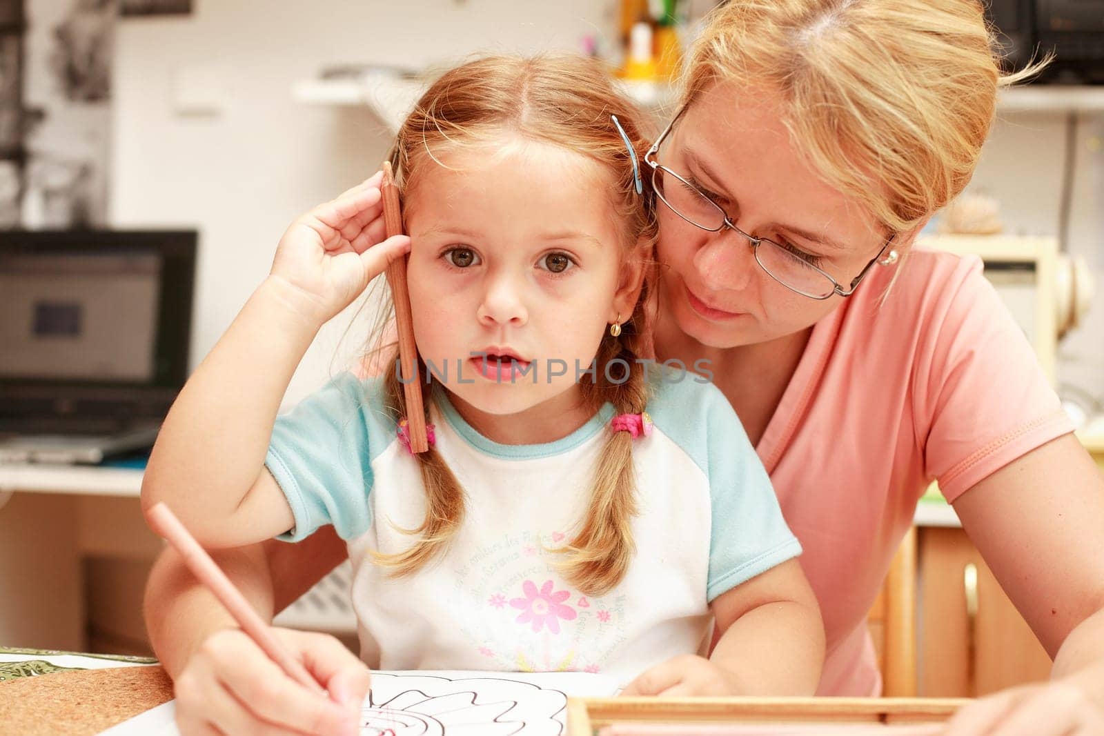 Mother and child paint together