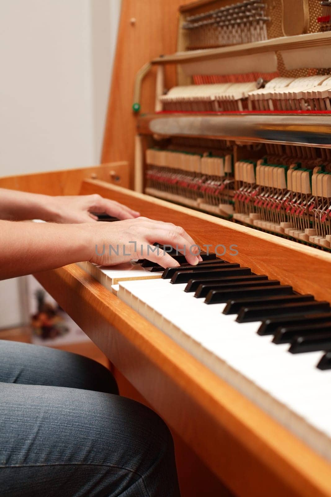 Detail of hands playing piano