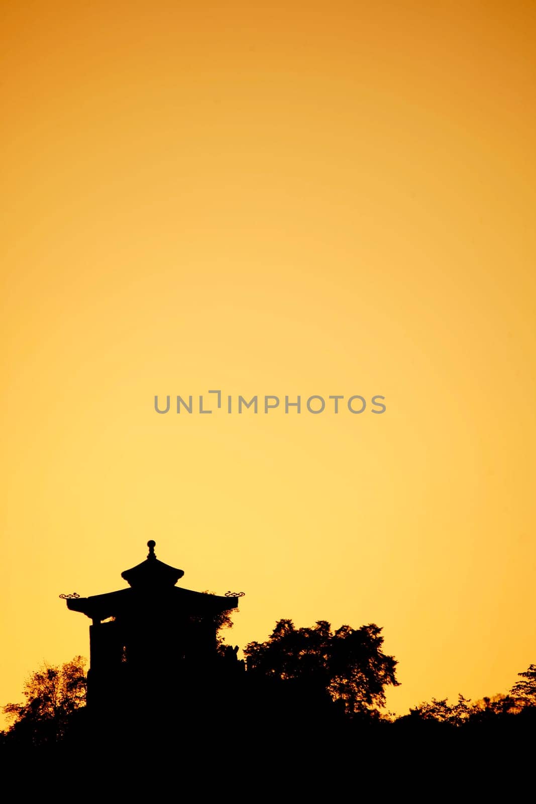 Chinese Temple silhouetted against the sunset