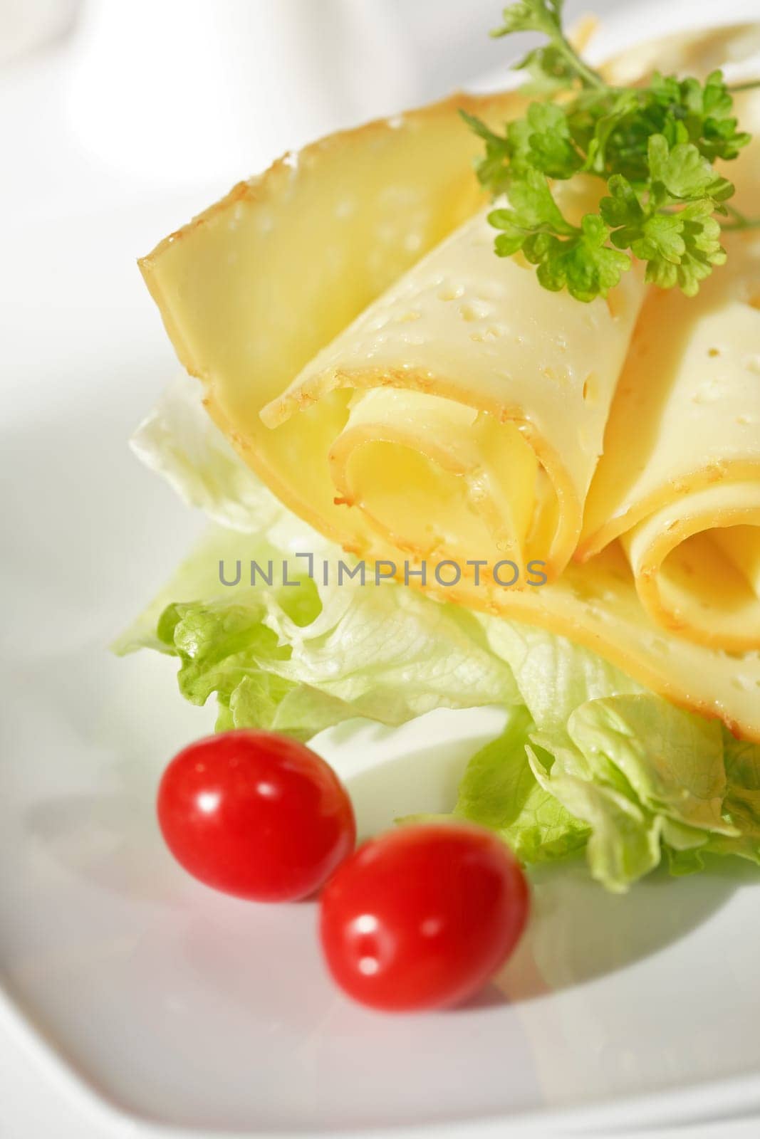 Two cheese rolls with salad and tomato