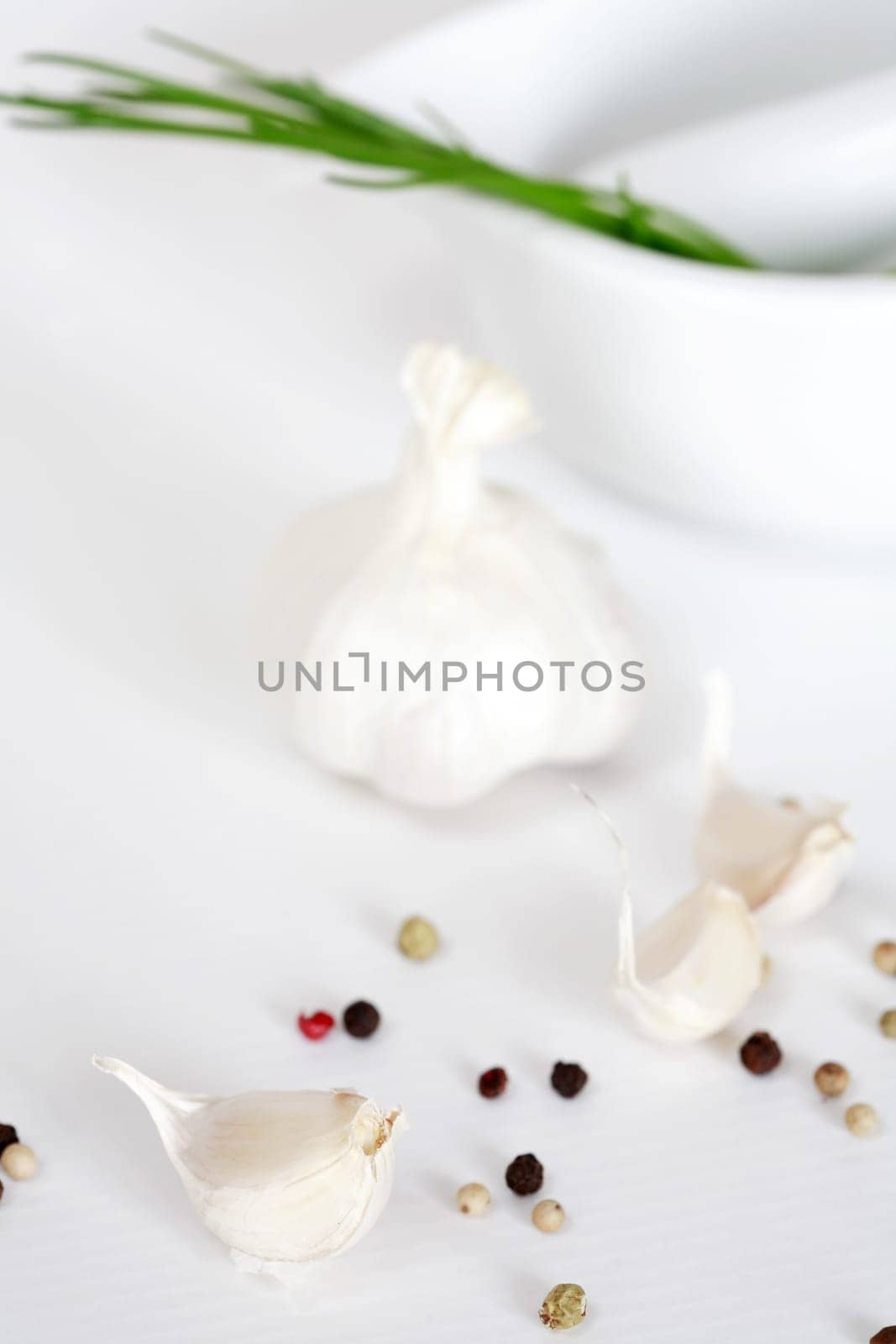 Garlic and pepper on white background