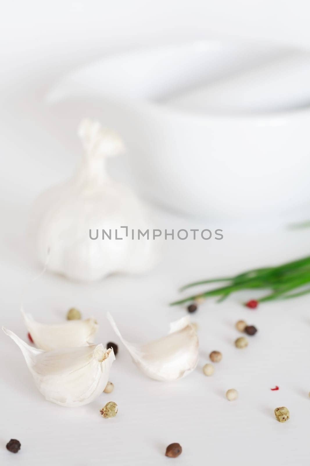 Garlic and pepper on white background