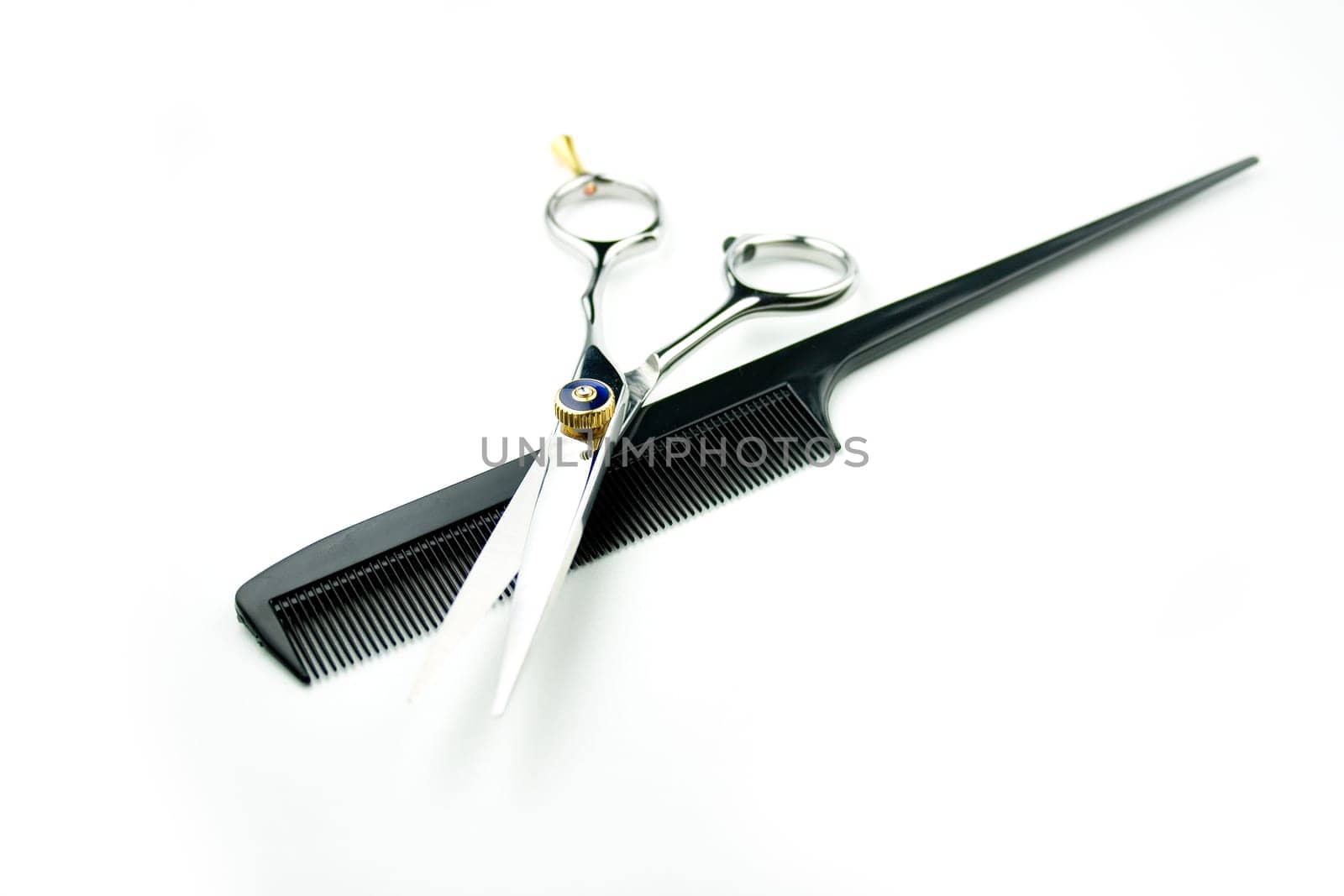 steel scissor w/ comb on white background