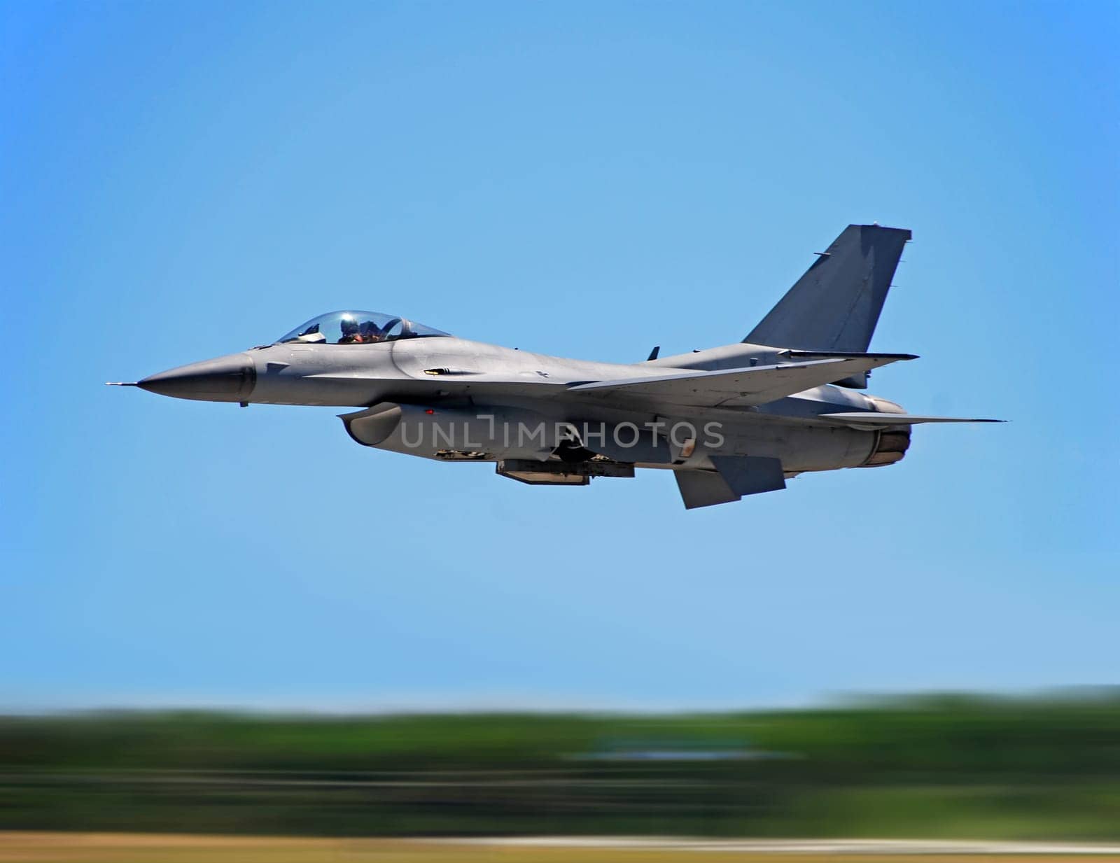 Military jet flying at hogh speed with motion blur