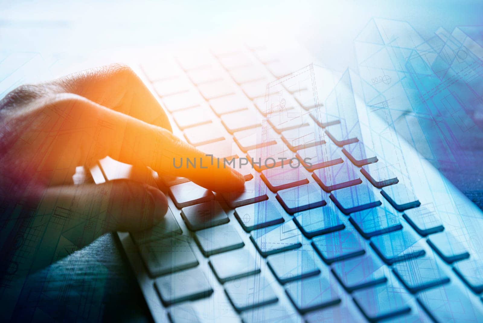 Closeup of architect hand typing on computer keyboard device in architectural design studio. Double exposure image with blueprint project and woman using office computer. Internet business and modern techology background concept.