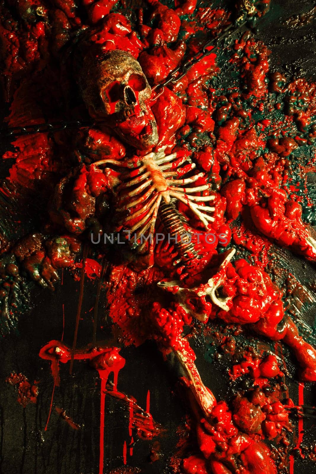Halloween image / background of blood, bones and guts.  Sculpture was built by me from a plastic skeleton, so I hold any copyrights.