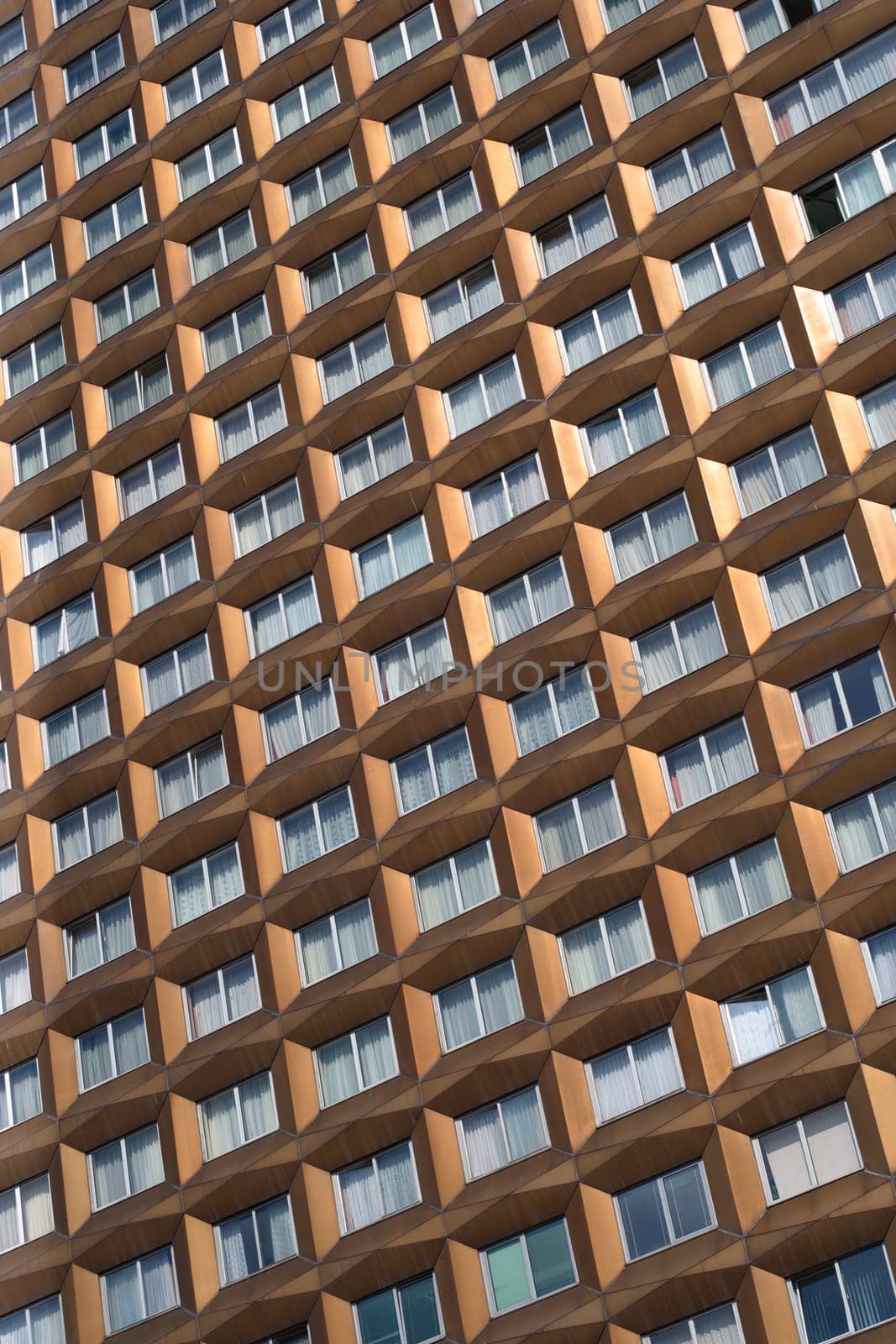 Curtained windows of a tall building in Bulgaria.