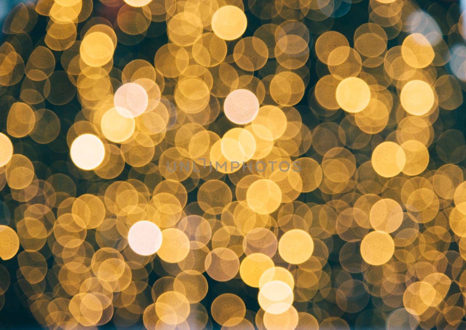 Golden blur background. Christmas holiday natural bokeh with defocused night lights.
