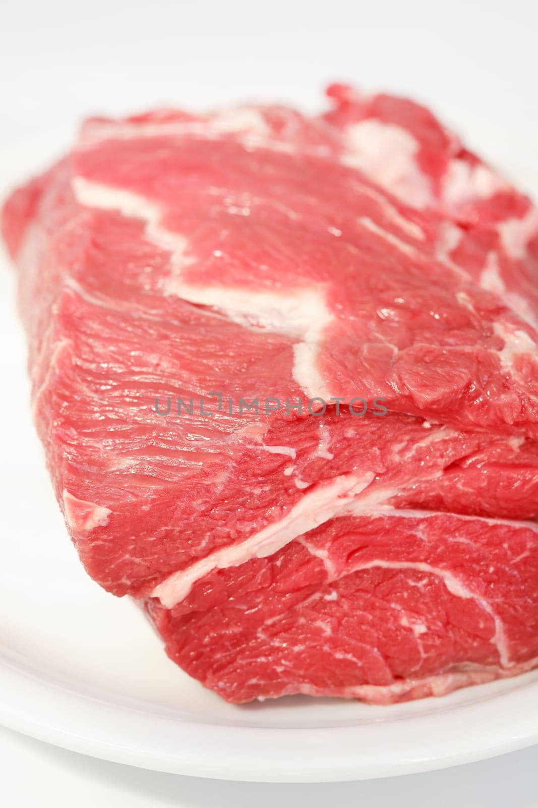 Raw beef meat on the plate