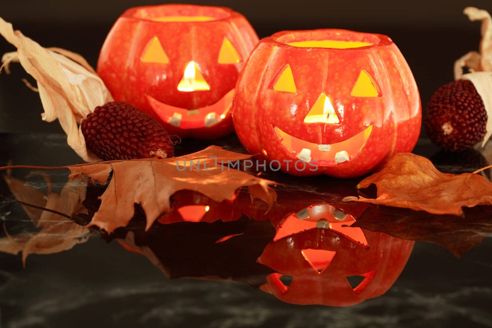 Halloween still life with small candle-lights