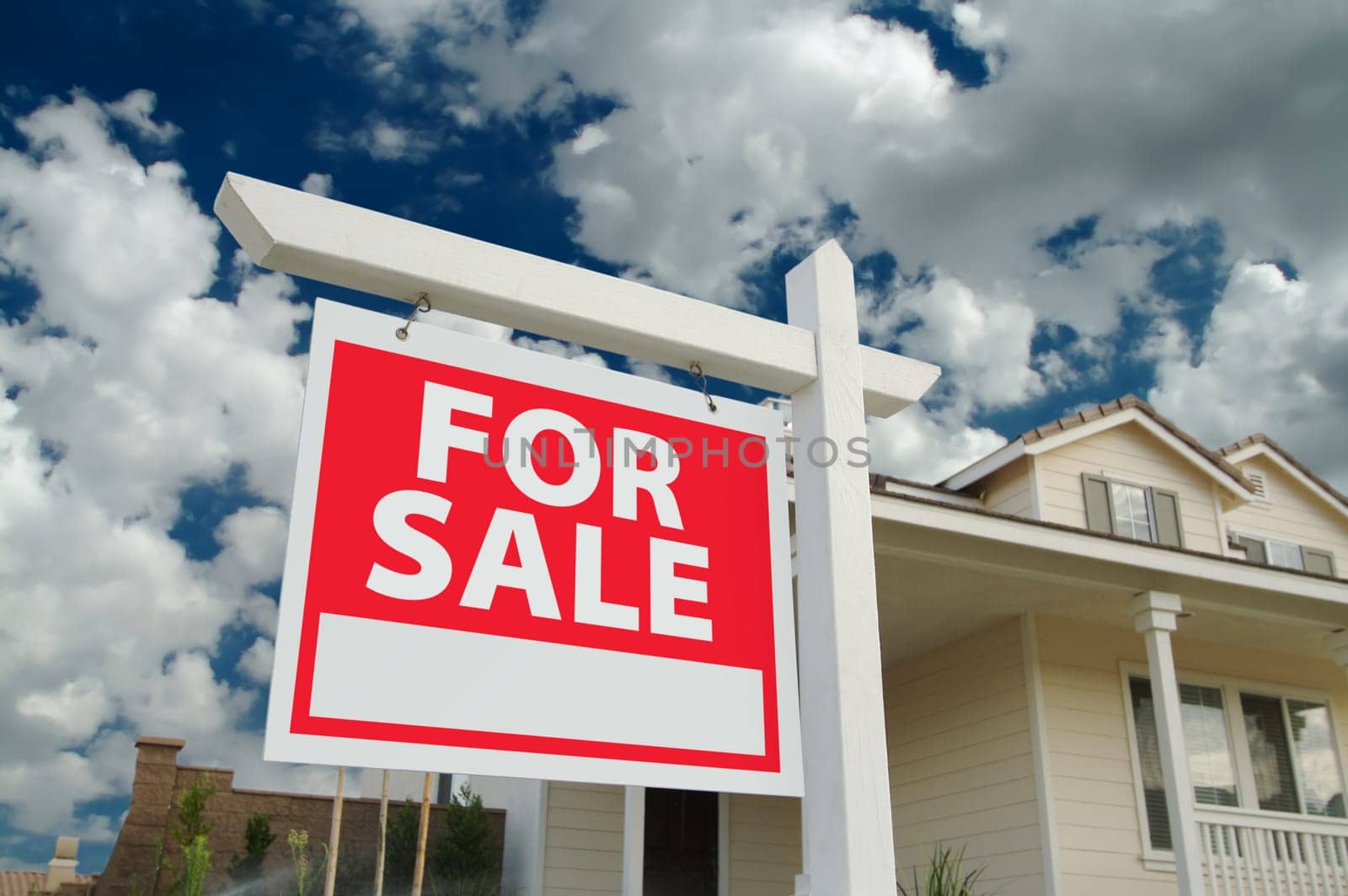 Home For Sale Sign in Front of Beautiful New Home.