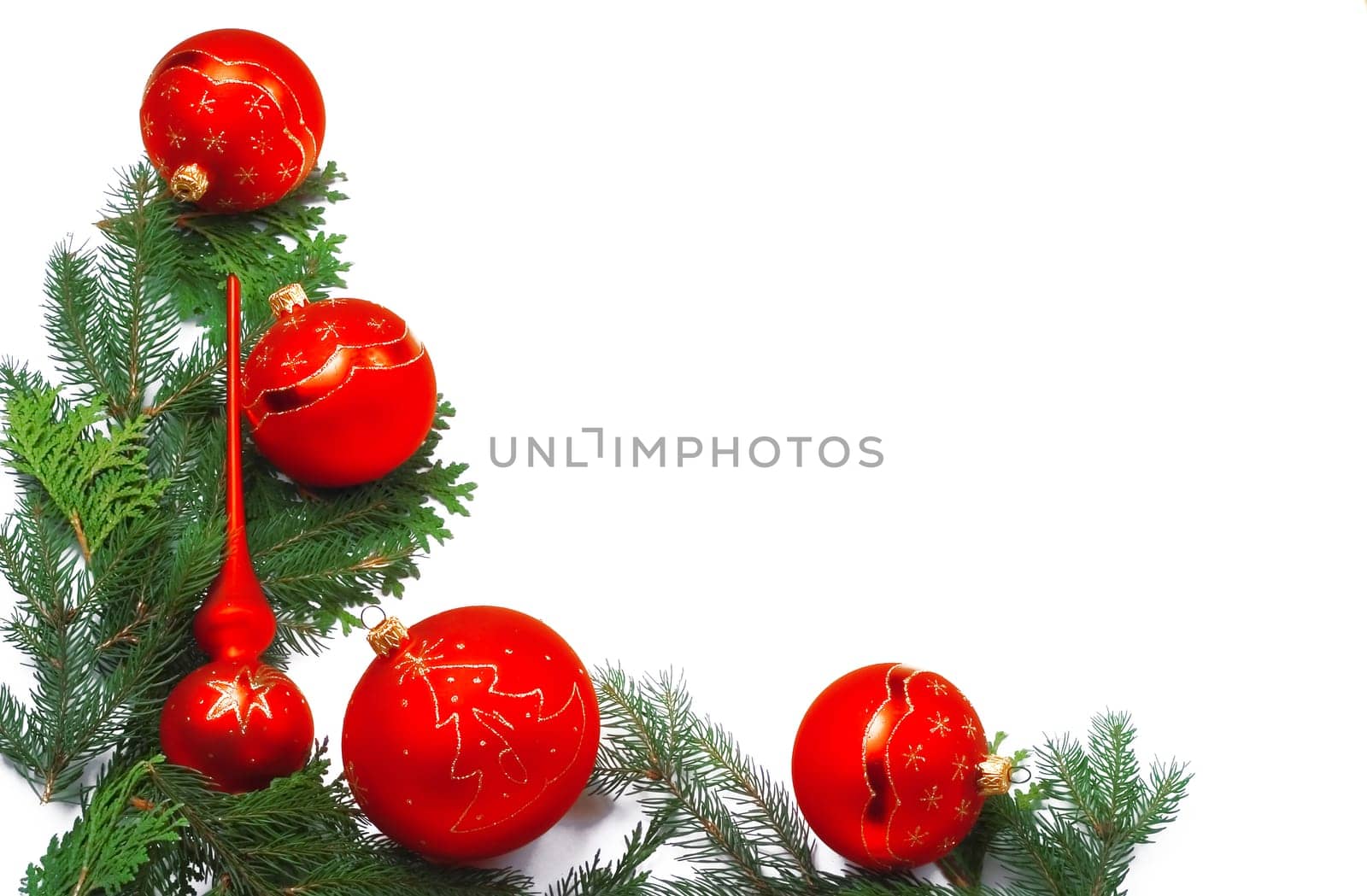 Christmas frame made of red balls and pine needles