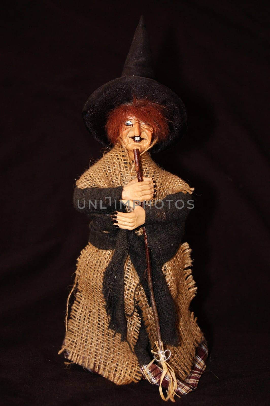 Witch with broom and hat. Isolated.  Horror, halloween, fantasy photo.