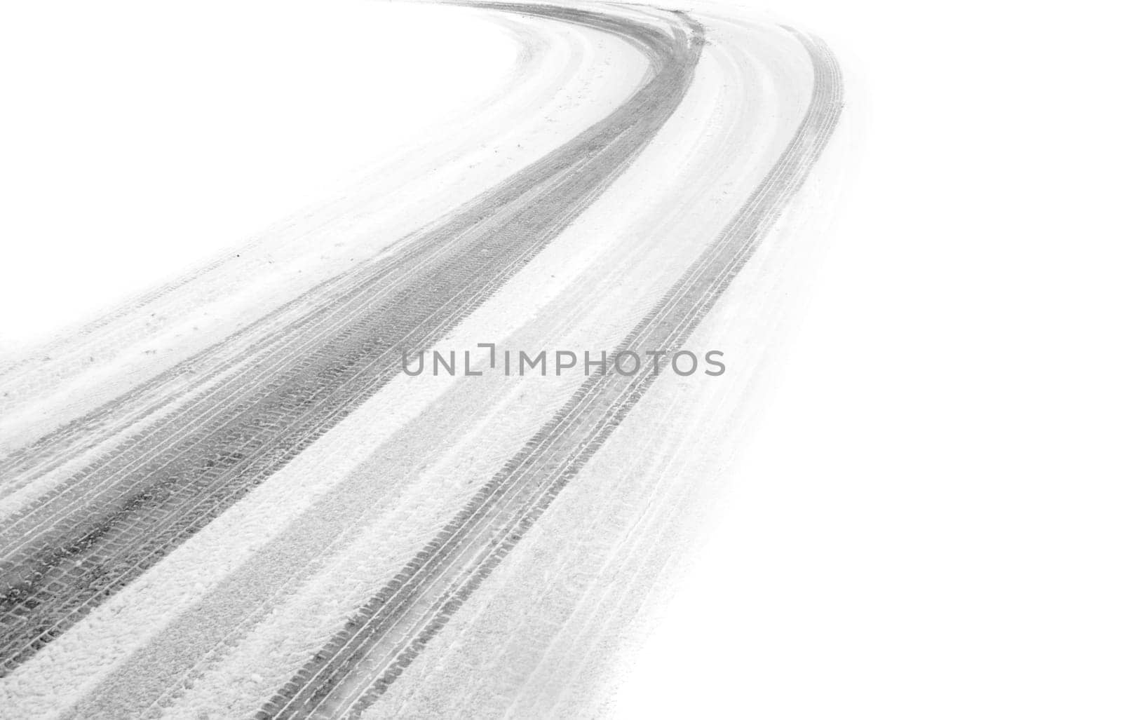 tire marks in the snow, fading to white on both sides