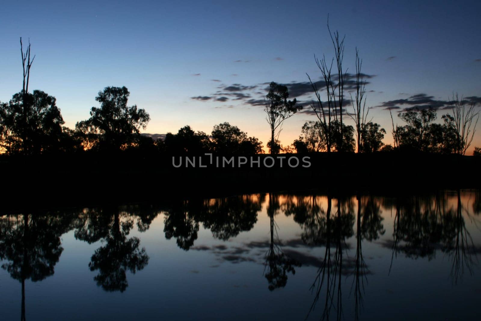 Dusk, looking over a quiet and peaceful lagoon.