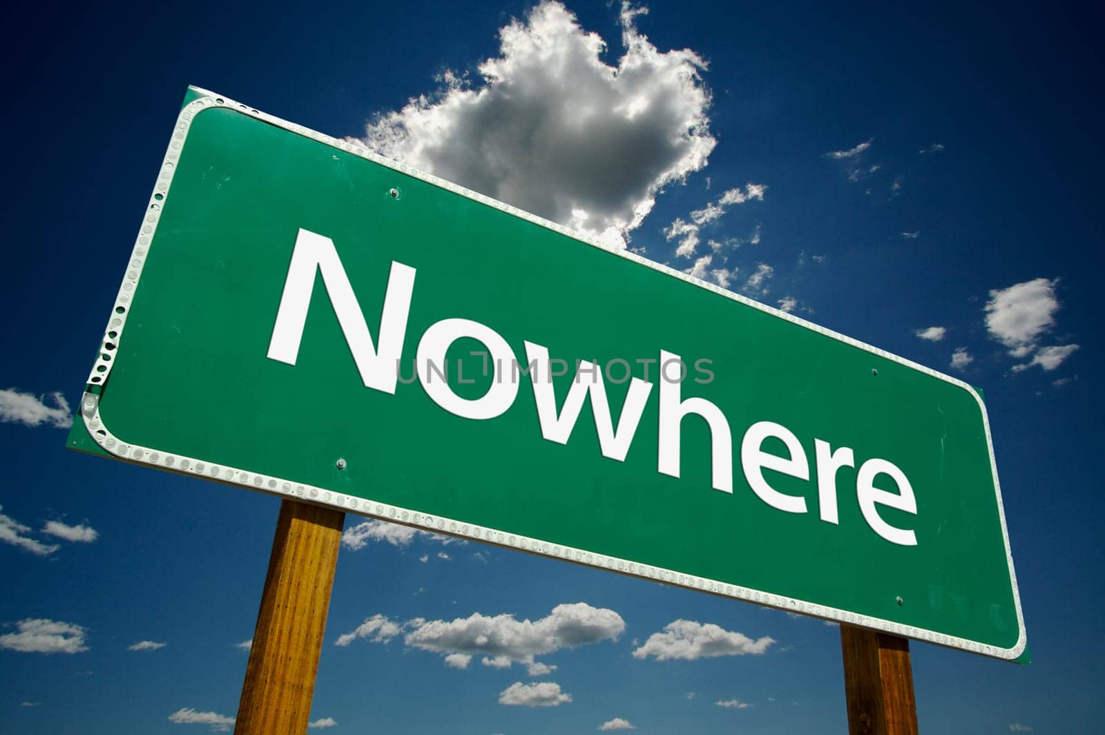 Nowhere Road Sign with dramatic blue sky and clouds.