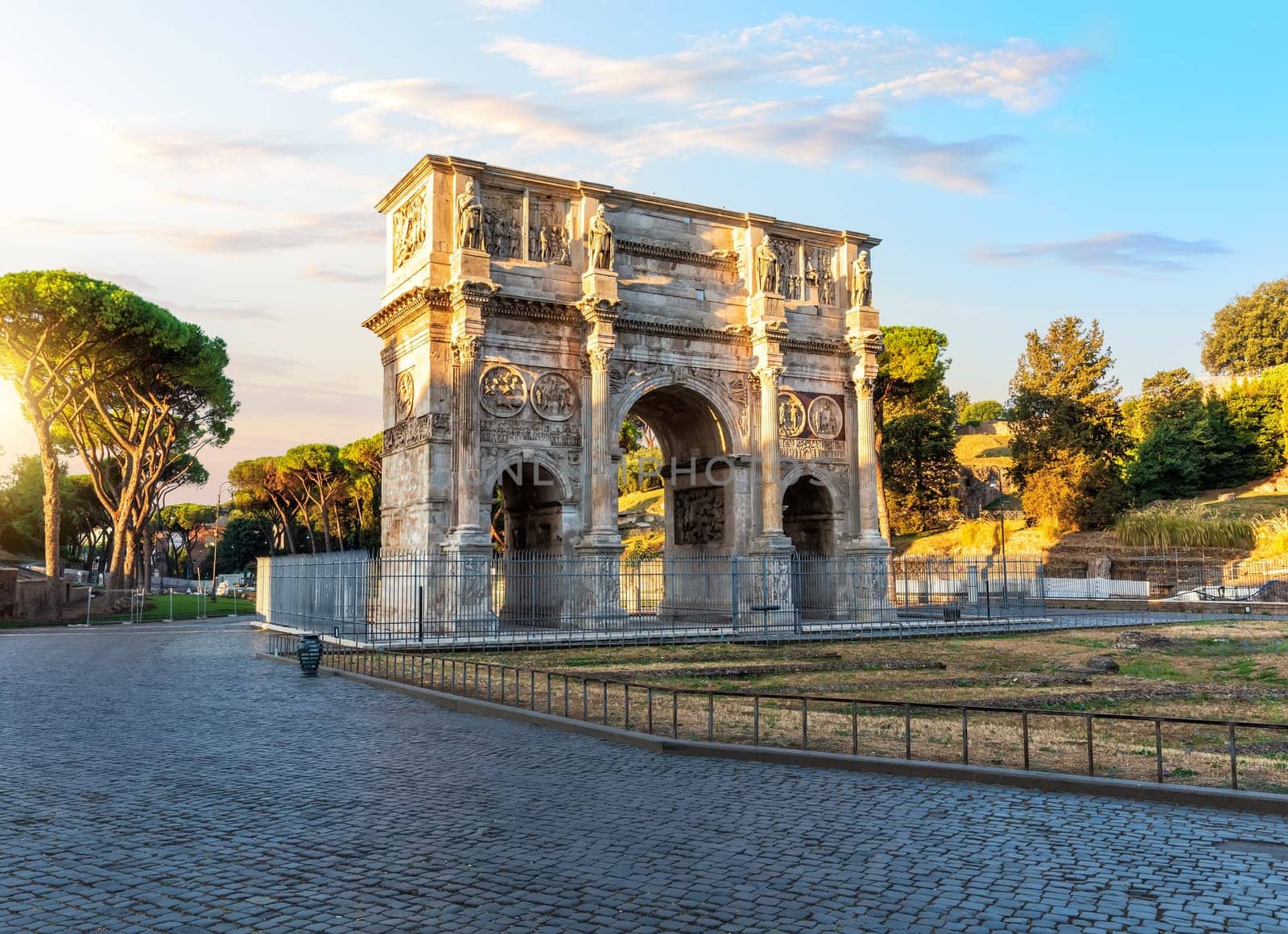 The Arch of Constantine at sunset, famous ancient triumphal arch of Rome, Italy.
