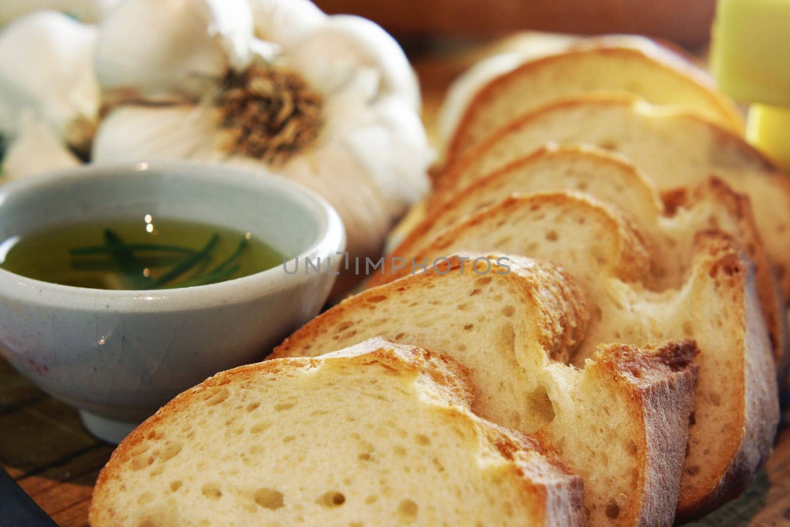 Preparation for making garlic bread. A series of pics in landscape and portrait format. Shallow and deep depth of field.