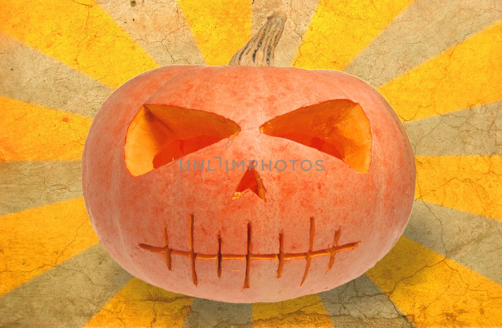 Spooky Halloween pumpkin  against grunge background