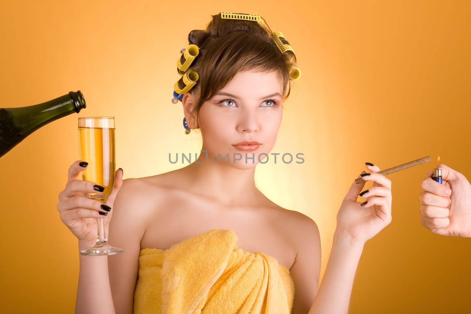 girl with hair-rollers holding a cigarette and a glass of wine