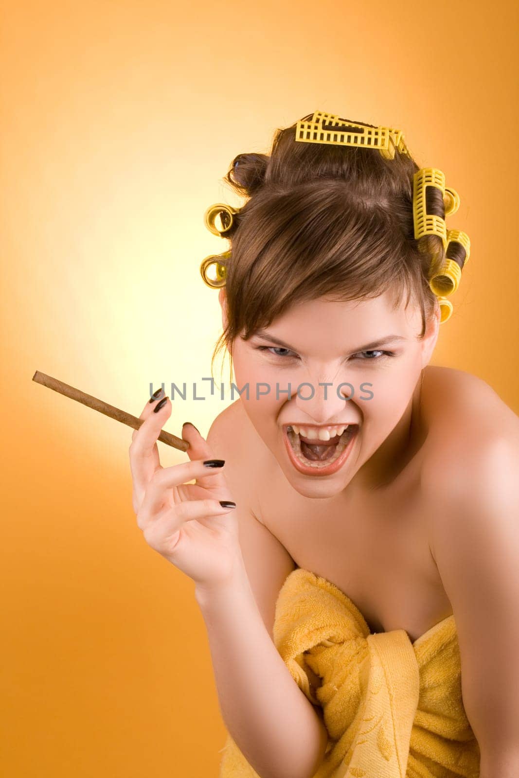 screaming girl with hair-rollers holding a cigarette