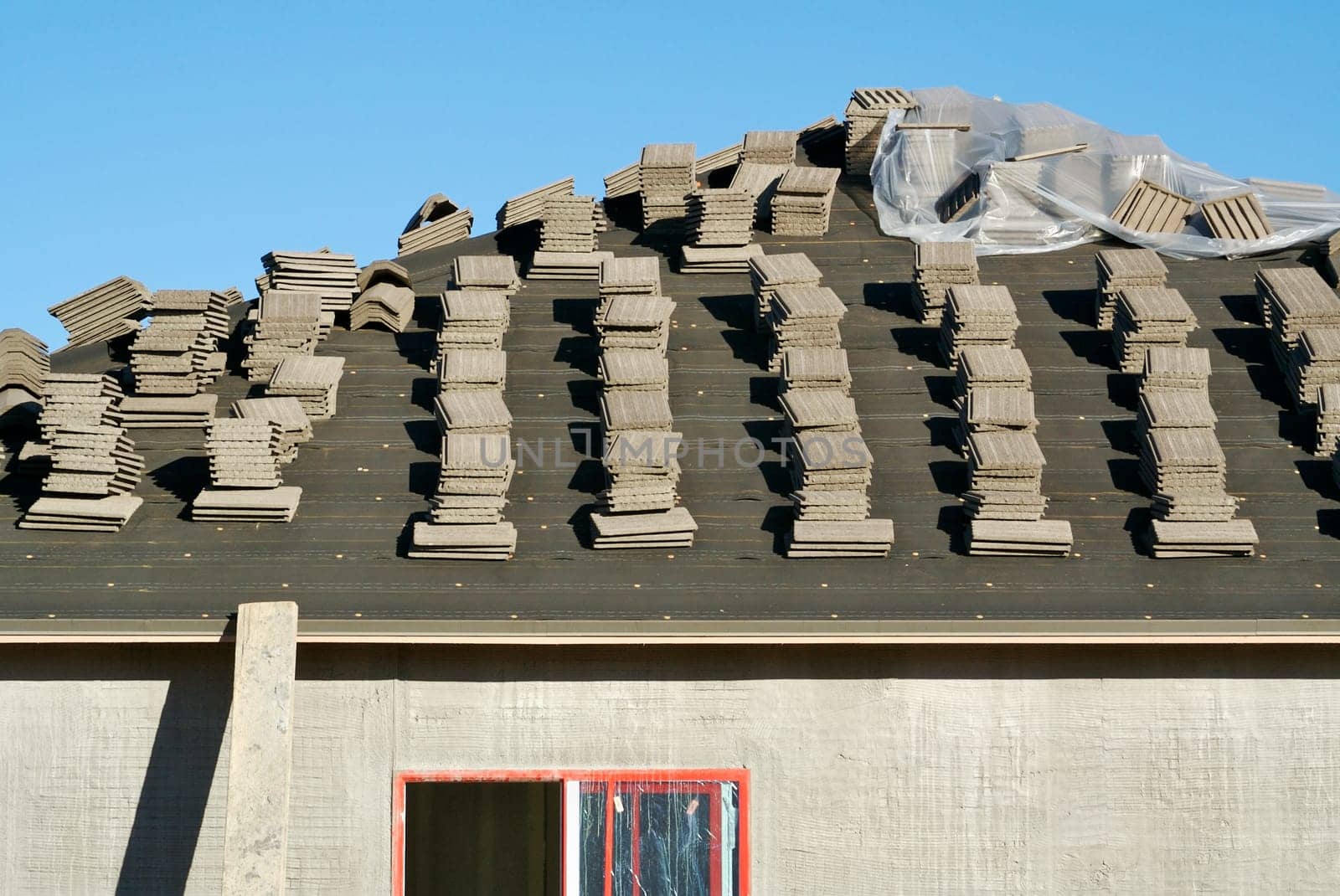 New Home Construction Site Roof and Tiles.