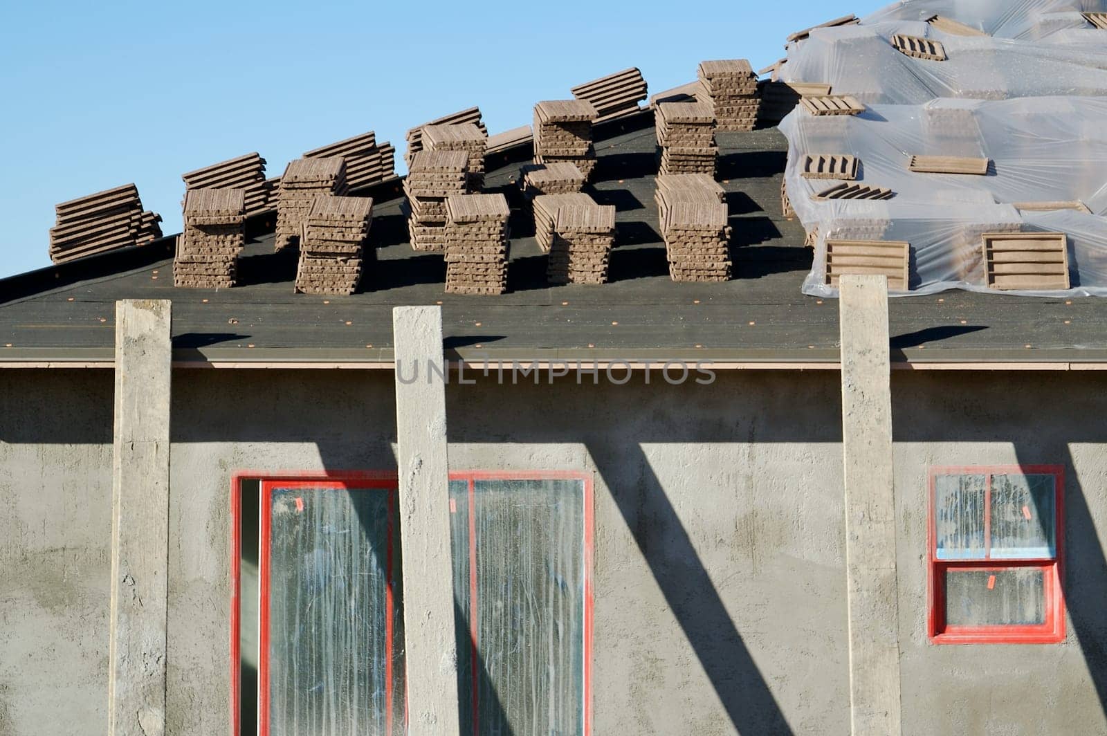 New Home Construction Site Roof and Tiles.