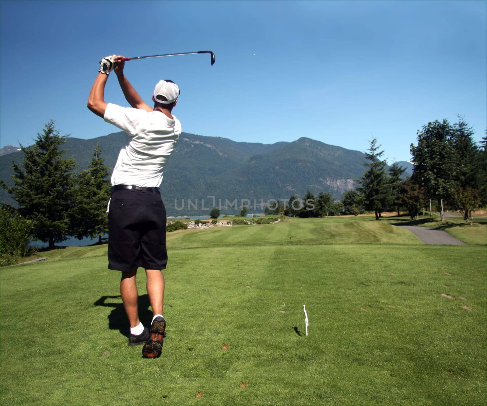 Golfer tees off