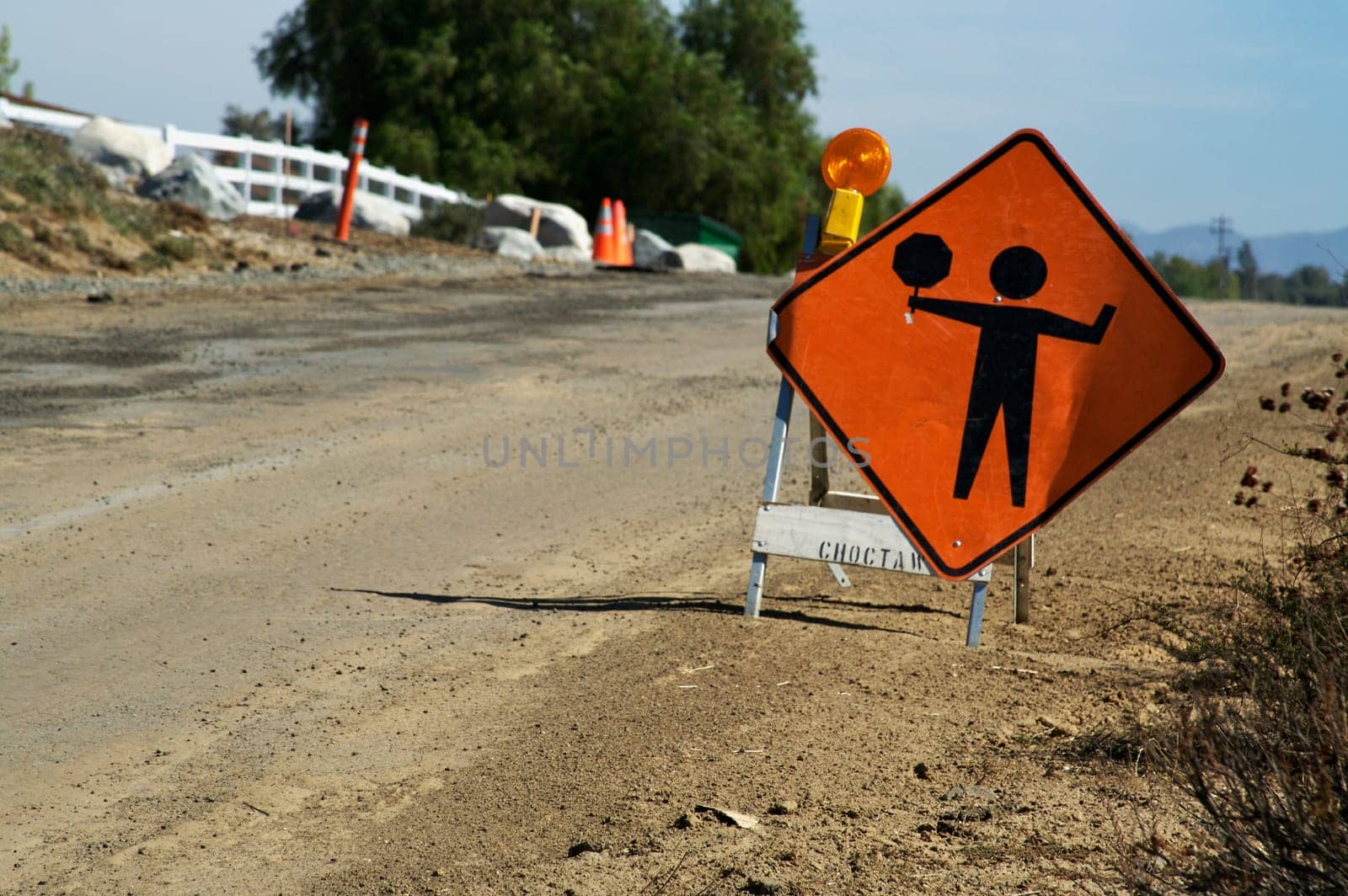 Signal ahead warning sign along the road side.