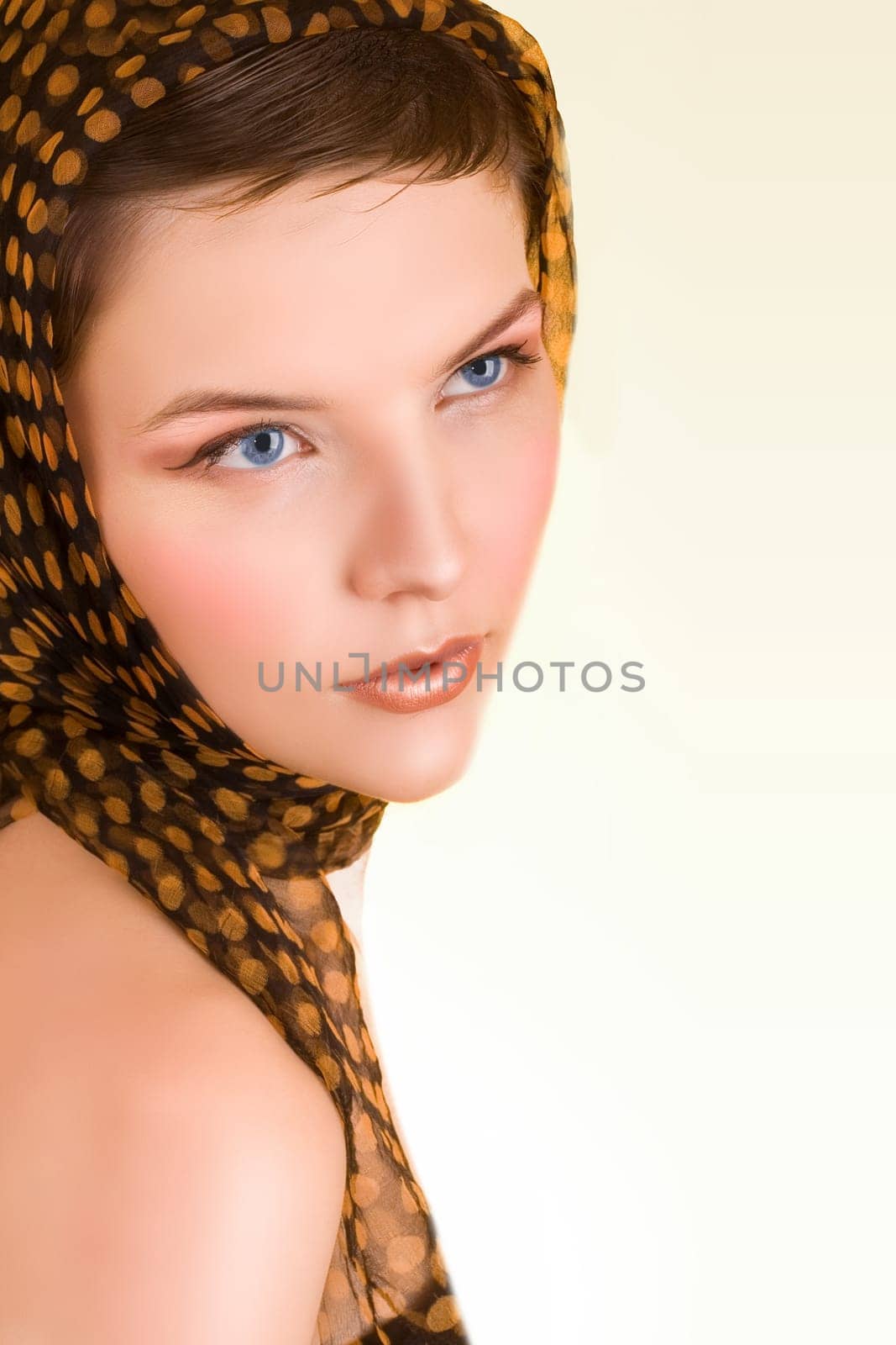 a glamorous girl in the evening dress wearing a scarf