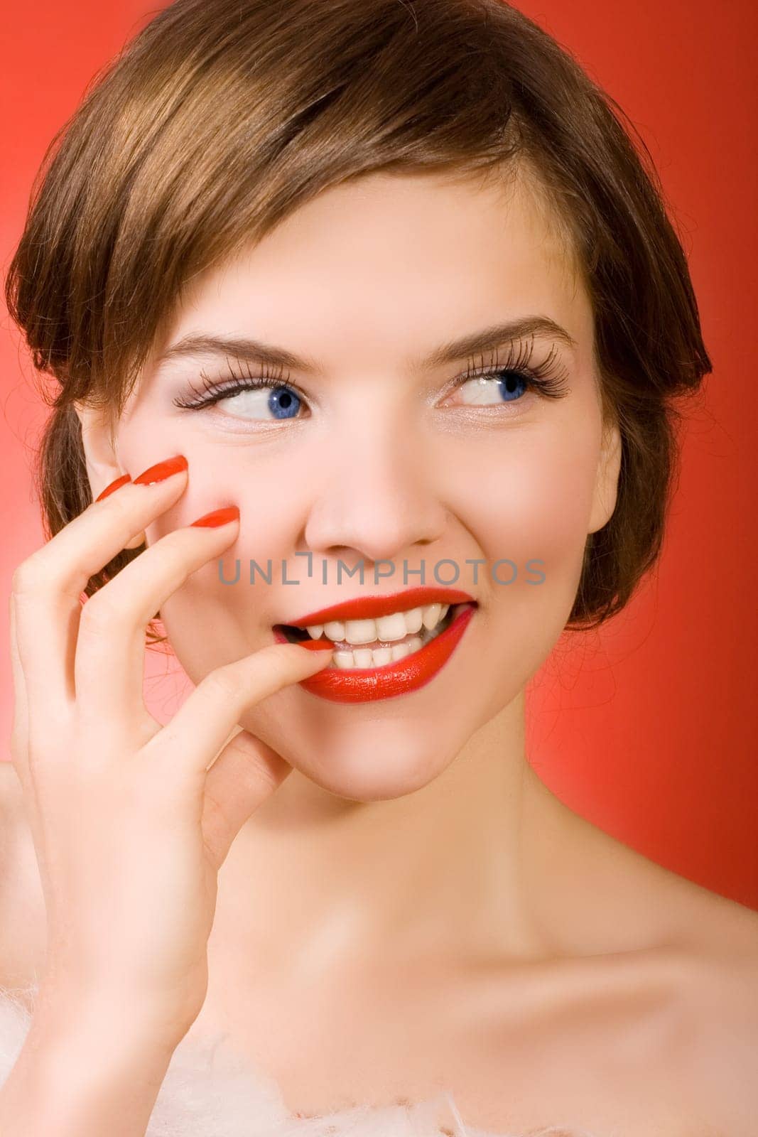 a  christmas girl over the red background