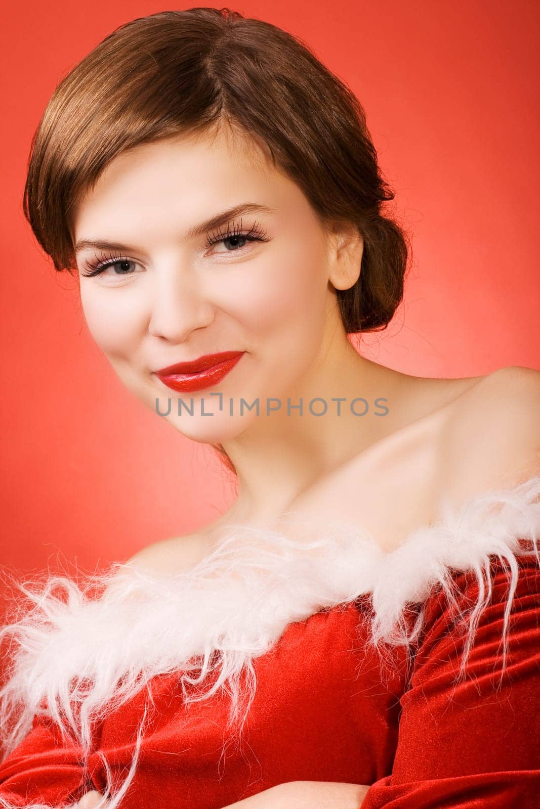 a  christmas girl over the red background
